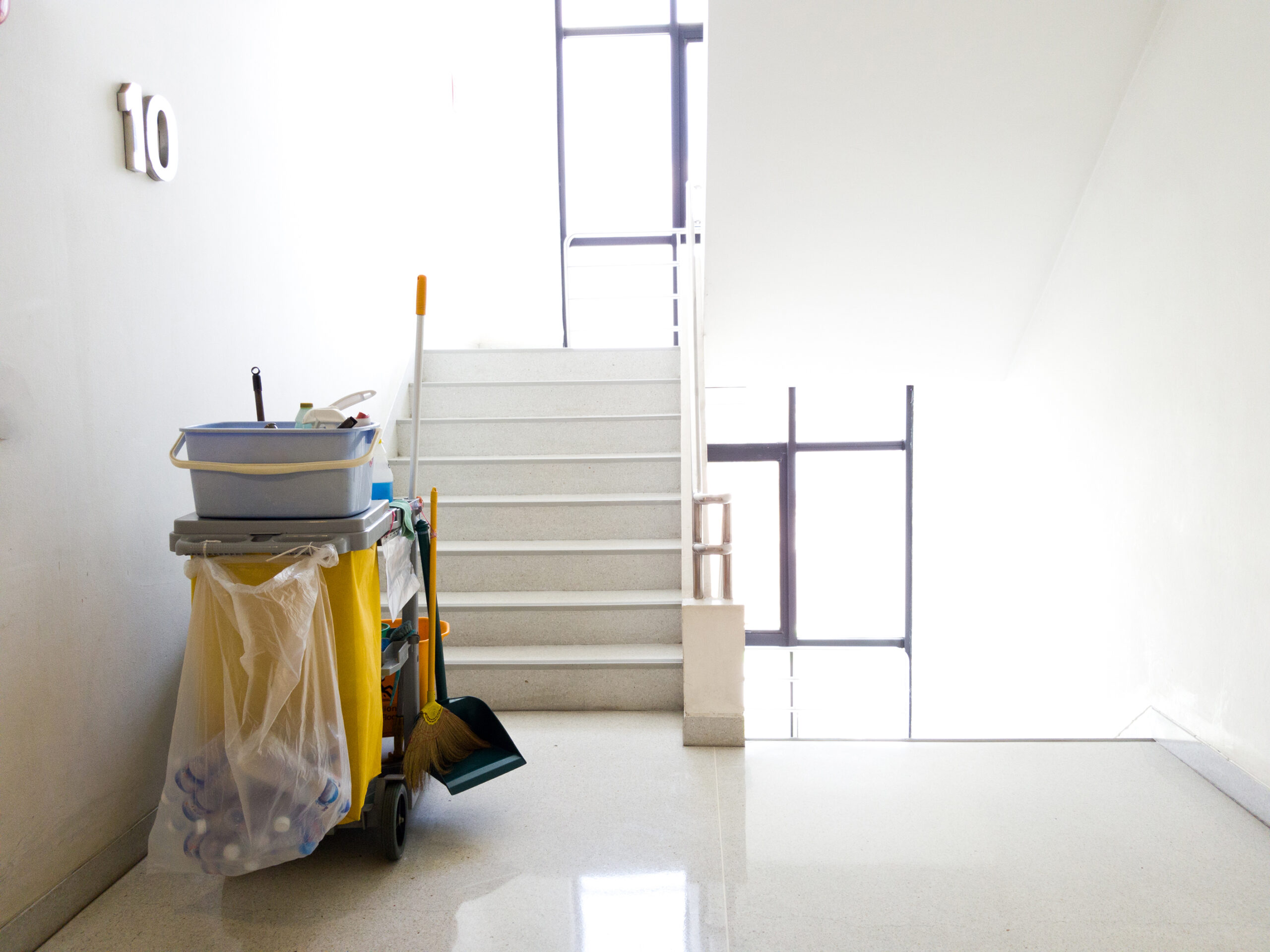 Cleaning tools cart wait for cleaner.Bucket and set of cleaning equipment in the office. janitor service janitorial for your place. Concept of service, worker and  equipment for cleaner and health